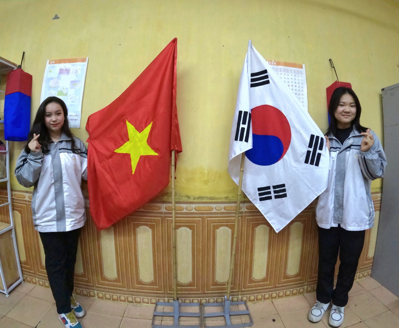 (Left) Dang My Anh and Pham Hai Yen, students in grade 10 at Marie Curie High School in Hai Phong’s Ngo Quyen district, pose for a photo after an interview with The Korea Herald on Feb. 9, 2023. (Choi Jae-hee / The Korea Herald)