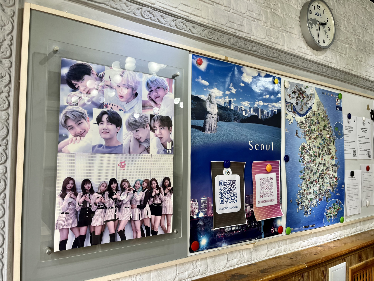 Photographs of K-pop artists are posted on the wall of the classroom at the King Sejong Institute in Tashkent. (Kim Arin/The Korea Herald)