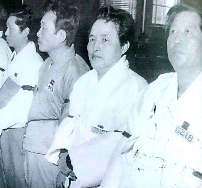 This photo shows Park Ki-rae (second from right) attending a court trial over allegations of spying for North Korea in the early 1970s. (Courtesy of bereaved family members of Park)