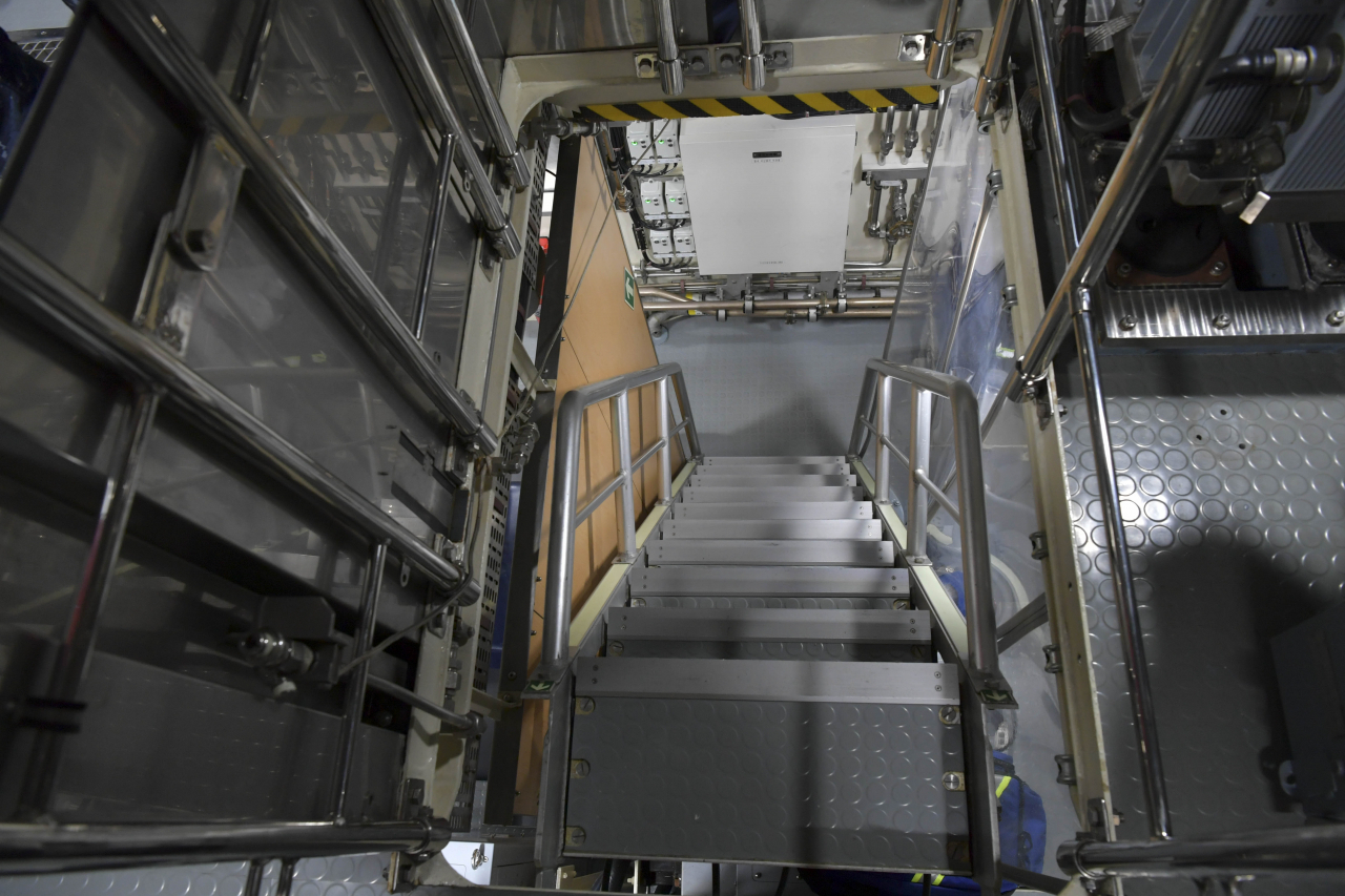 Stairs inside the 3,000-ton Dosan Ahn Changho submarine while being docked at the Jinhae naval base in the city of Changwon, South Gyeongsang Province, Wednesday. The ladders provide access between different decks or compartments within the submarine. (Republic of Korea Navy)