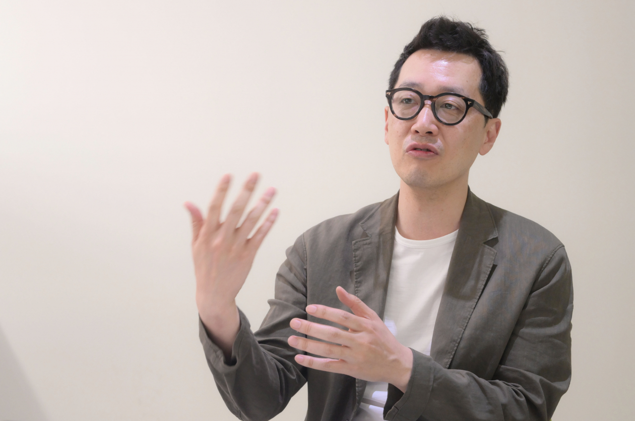 Choi Jae-won, vice president of SAMG Entertainment, speaks during an interview with The Korea Herald. (Lee Sang-sub/ The Korea Herald)
