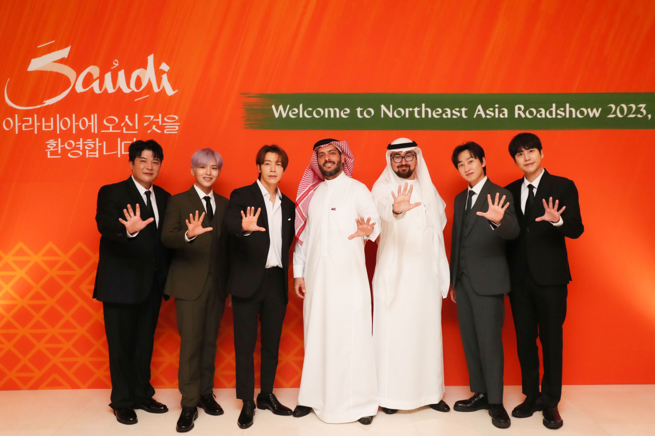 Left: Super Junior's Shindong, Ryeowook and Donghae, Head of APAC region for the Saudi Tourism Authority Alhasan Aldabbagh, Trade Markets Director of Korea & Japan at Saudi Tourism Authority Eyad Jan, Super Junior's Eunhyuk and Kyuhyun poses for a photo at the inauguration ceremony held in Seoul on Monday. (SM Entertainment)
