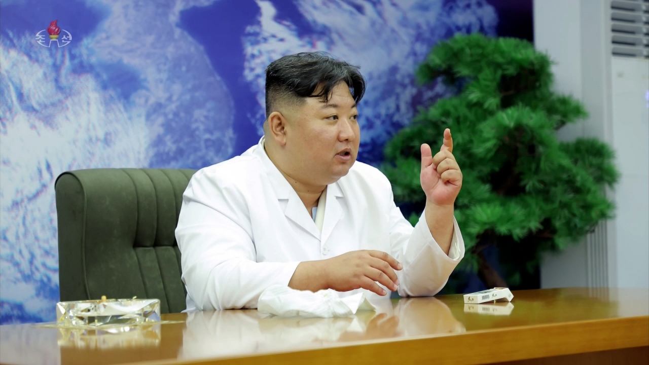 North Korean leader Kim Jong-un is seen at a meeting with the members of the non-permanent satellite launch preparatory committee in Pyongyang on May 16. (KCNA-Yonhap)