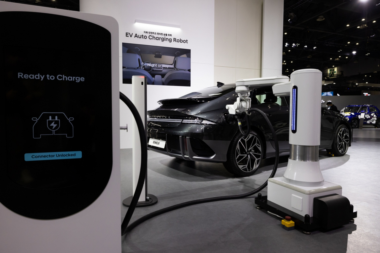An electric vehicle charging robot charges a Hyundai Ioniq 6 EV during the Seoul Mobility Show in Goyang, Gyeonggi Province on March 30. (Bloomberg)