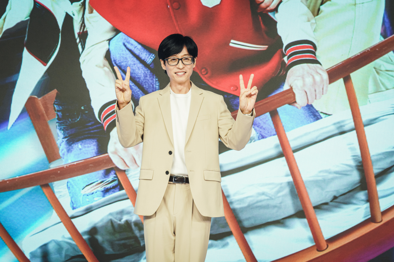 Yoo Jae-suk poses for photos before a press conference at JW Marriott Dongdaemun Square in Jongno-gu, central Seoul, on Tuesday. (Walt Disney Co. Korea)
