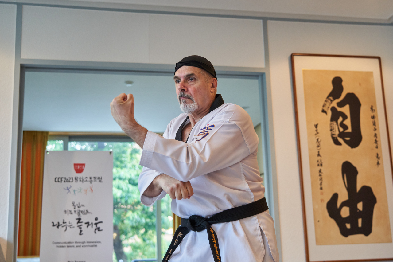 French Ambassador Philippe Lefort demonstrates his taekwondo moves during CCF 2023, held at the French ambassador's residence in Seoul, Tuesday. (CICI)