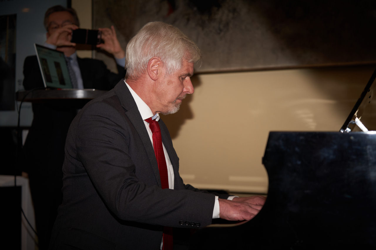 German Ambassador Michael Reiffenstuel plays the piano during CCF 2023, held at the French ambassador's residence, Tuesday. (CICI)