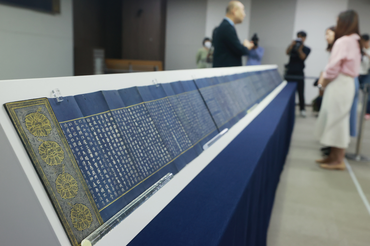 Vol. 6 of Saddharmapundarika Sutra, also known as the Lotus Sutra, is displayed at the National Palace Museum of Korea in Seoul, Thursday. (Yonhap)