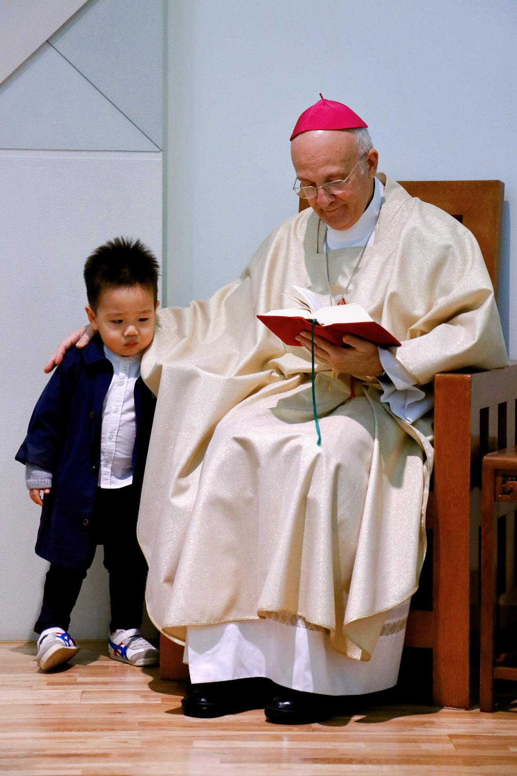 Alfred Xuereb (right), Vatican Ambassador to Korea, is photographed with a baptized Korean child named Little Joseph. (Vatican Embassy in Korea)