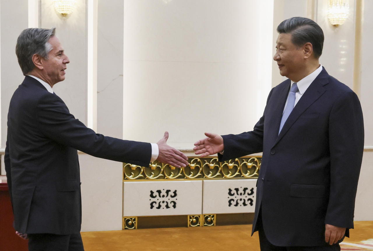 This photo shows US Secretary of State Antony Blinken (Left) shaking hands with Chinese President Xi Jinping at the Great Hall of the People in Beijing during his two-day trip to China on Monday. (AFP)