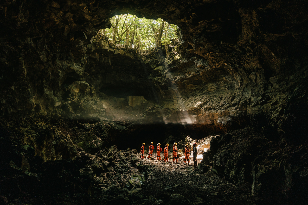 Visitors take part in Jeju Island's lava tube walking tour at last year's World Heritage Festival. (CHA)