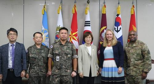 This photo shows South Korean and US officials posing for a photo during the second session of the South Korea-US ICT Cooperation Committee in Seoul on August 12, 2022. (Defense ministry)