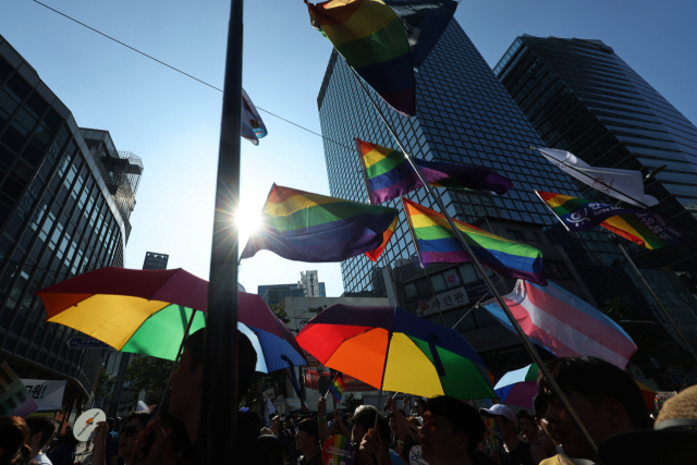 Rainbow umbrellas, which represent the idea of shelter, protection and unity within the LGBTQ+ community, are seen at the 24th Seoul Queer Culture Festival in Euljiro, Seoul, Saturday. (Yonhap)
