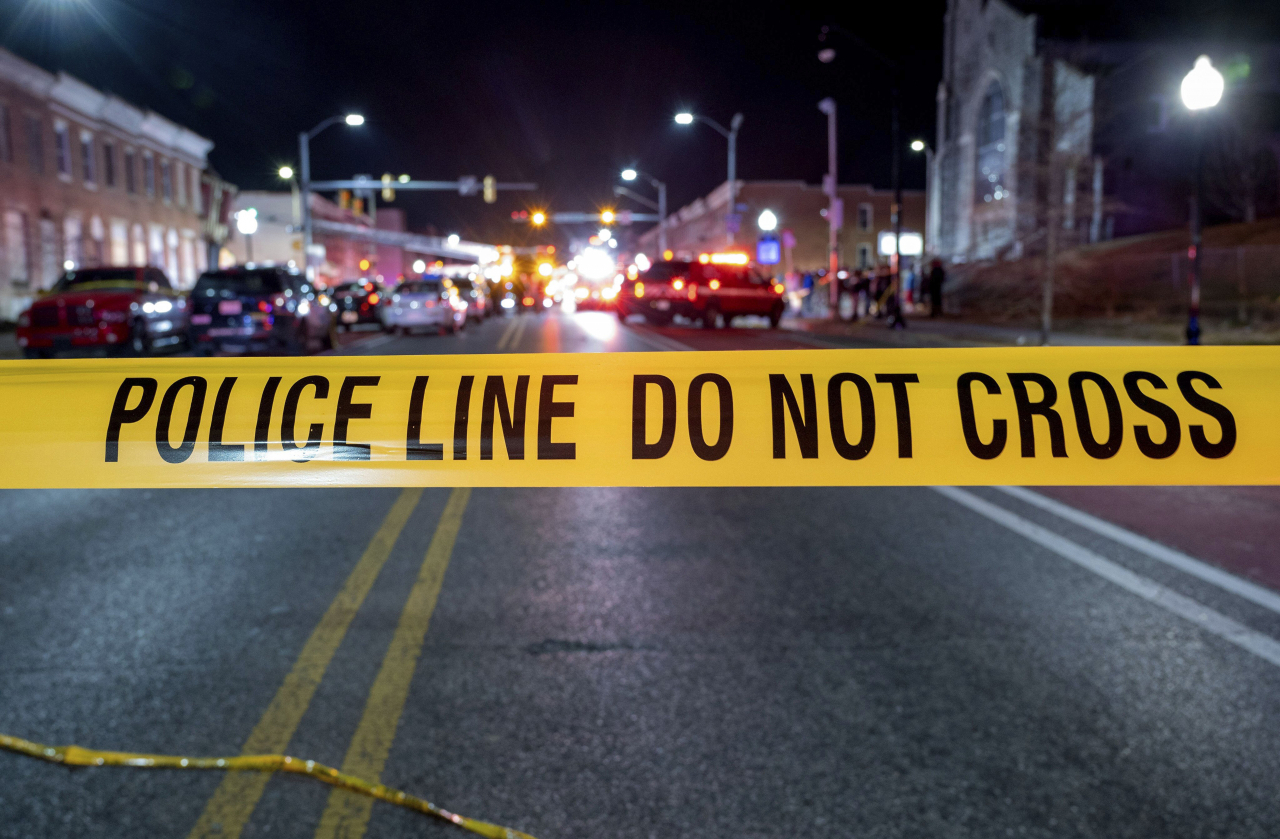 Police tape cordons off the area of a mass shooting incident in the Southern District of Baltimore, Maryland, early Sunday, July 2, 2023. Police say a number of people were killed and dozens were wounded in a mass shooting that took place during a block party just after midnight. (Baltimore Police Department)