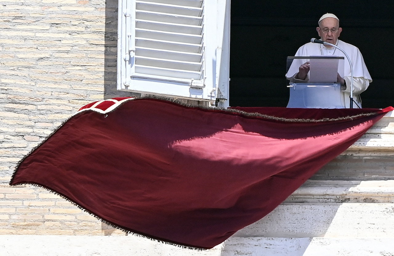 Pope Francis leads his Sunday Angelus prayer from the window of his office overlooking Saint Peter's Square, Vatican City, on Sunday. EPA/RICCARDO ANTIMIANI