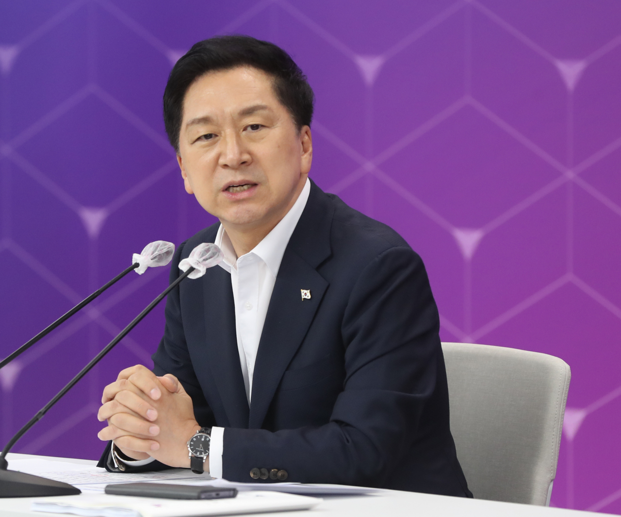 Rep. Kim Gi-hyeon, leader of the ruling People Power Party, is seen answering questions from reporters at a meeting held in the southeastern port city of Ulsan last Wednesday. (Yonhap)