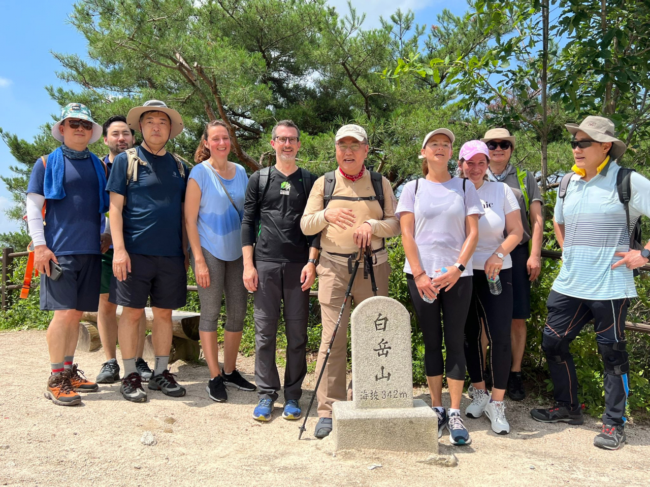Slovenian Deputy Prime Minister Tanja Fajon and South Korean Foreign Minister Park Jin pose for a group photo at Bugak Mountain on July 1. (Twitter handle of Tanja Fajon)