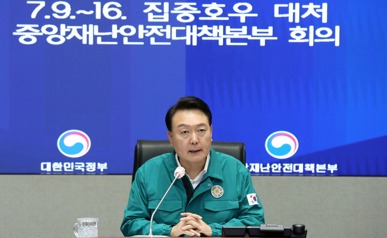 President Yoon Suk Yeol speaks during a disaster response meeting of the Central Disaster and Safety Countermeasures Headquarters at the government complex in Seoul on Monday, to deal with torrential rains hitting the country and minimize possible damage. (Yonhap)