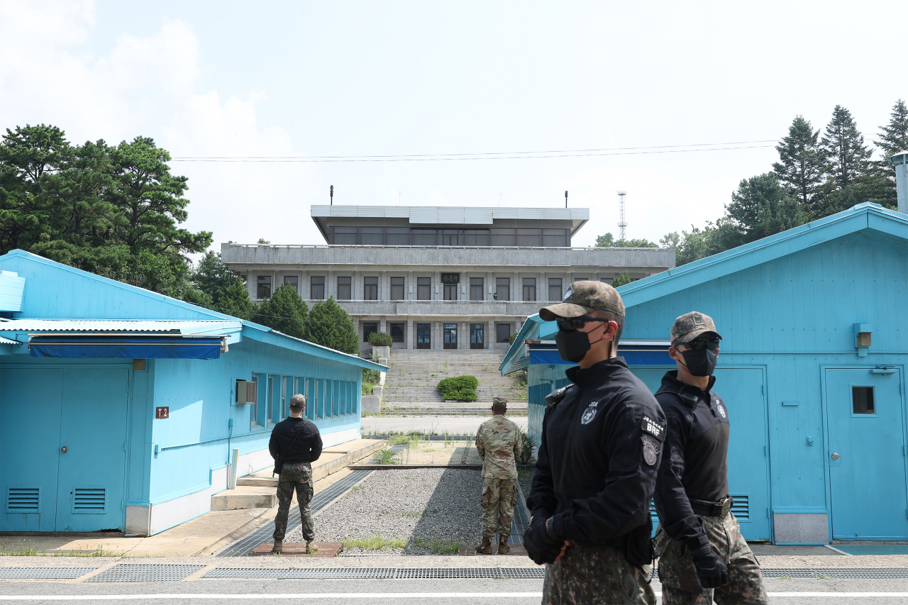 South Korean military personnel stand near conference buildings in the Joint Security Area at Panmunjom within the Demilitarized Zone, which separates the two Koreas, in July 2022. (Photo - Joint Press Corps)