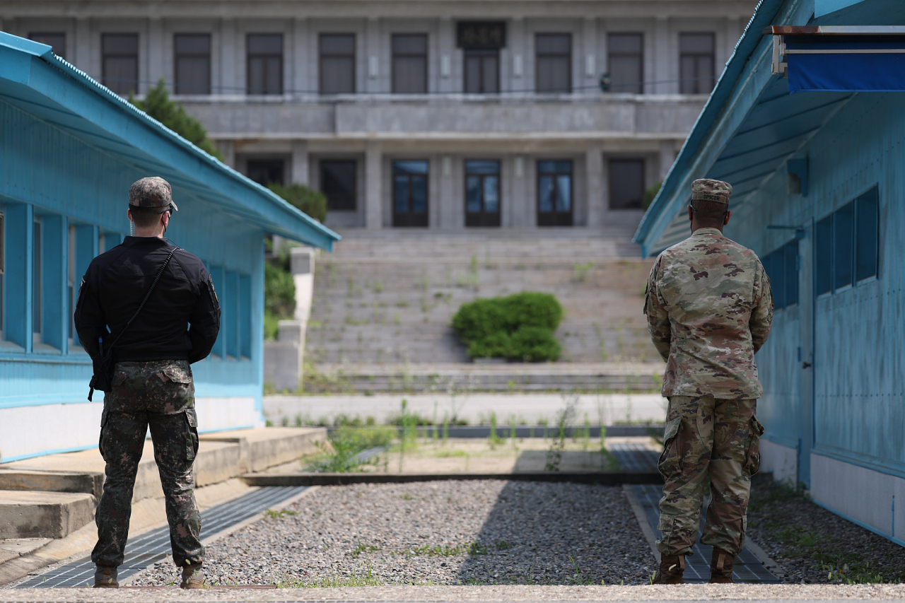 South Korean and US security guards stand side by side in the Joint Security Area at Panmunjom within the Demilitarized Zone, which separates the two Koreas, in July 2022. (Photo - Joint Press Corps)