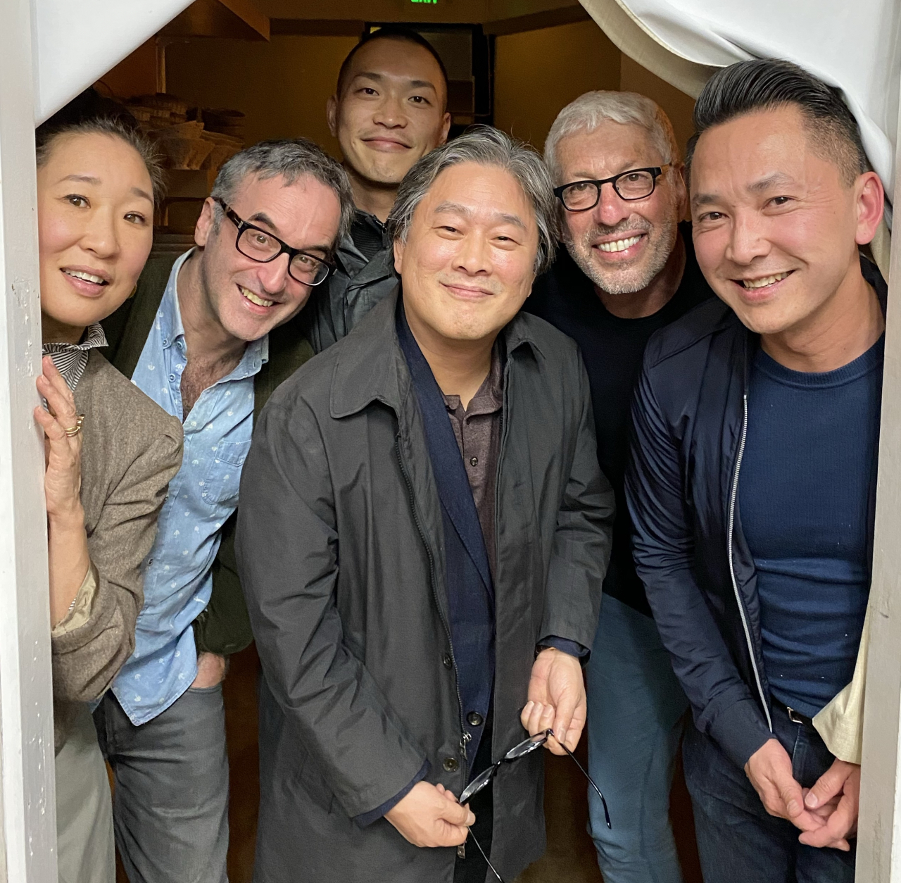 From left: Actor Sandra Oh, head writer Don McKellar, interpreter Jaehuen Chung, director Park Chan-wook, producer Niv Fichman and writer Viet Thanh Nguyen in March 2020. (Courtesy of Viet Thanh Nguyen)