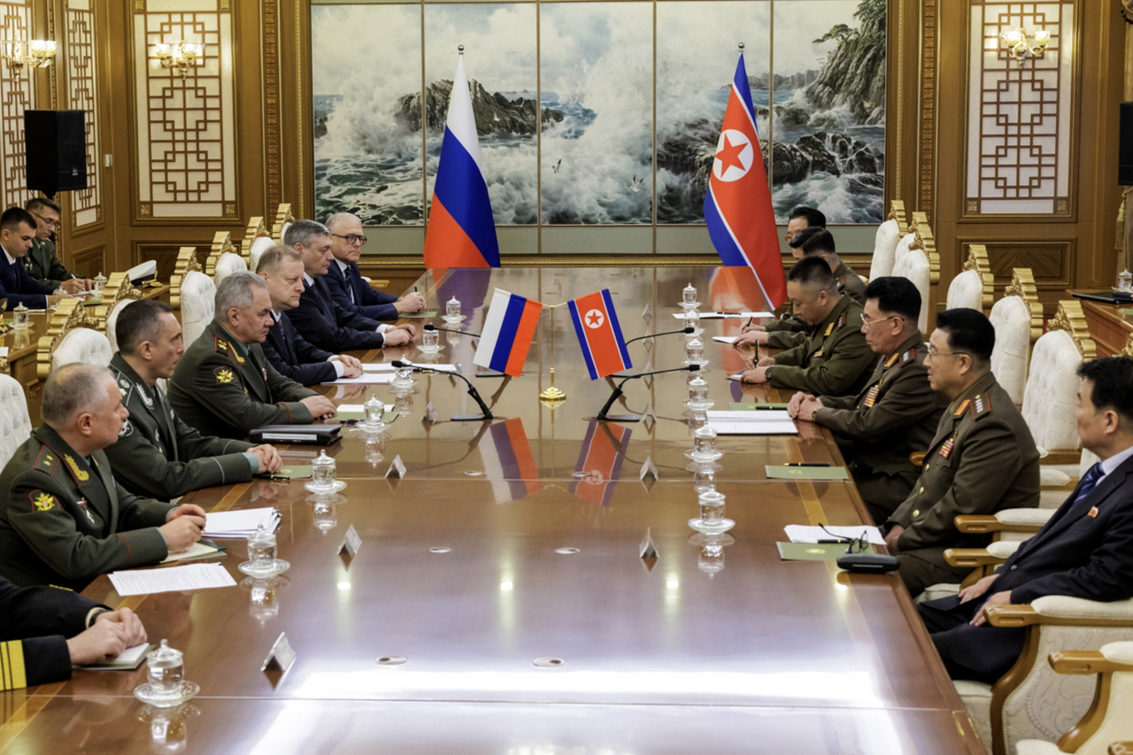 A handout photo made available by the Russian Defence Ministry shows Russian Defense Minister Sergei Shoigu (3-L) attending a meeting with North Korea's Defence Minister General Kang Sun-nam (3-R) in Pyongyang, North Korea on Wednesday. (Russian Defense Ministry)