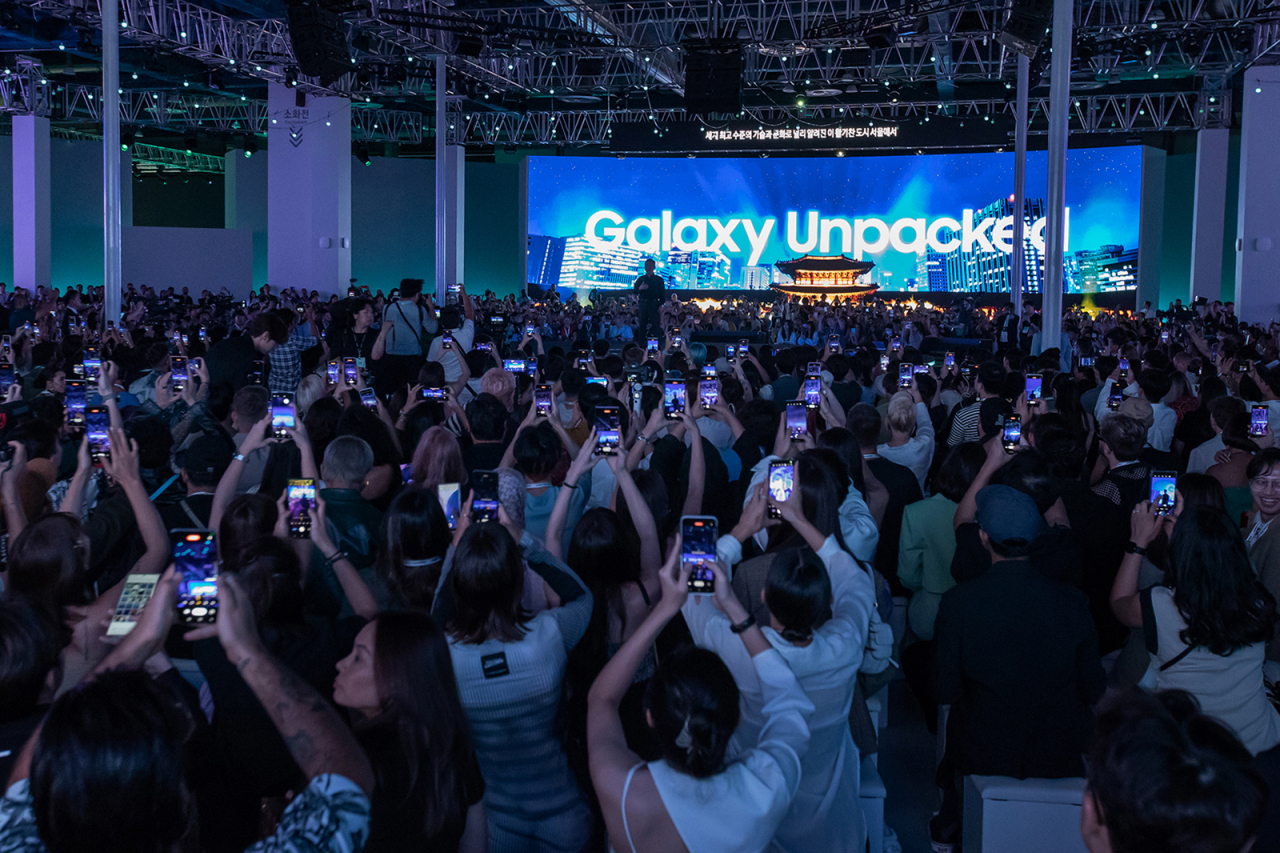 Attendees take photos with their smartphones during the Samsung Electronics' Galaxy Unpacked 2023 event at Coex in southern Seoul on Wednesday. (Samsung Electronics)