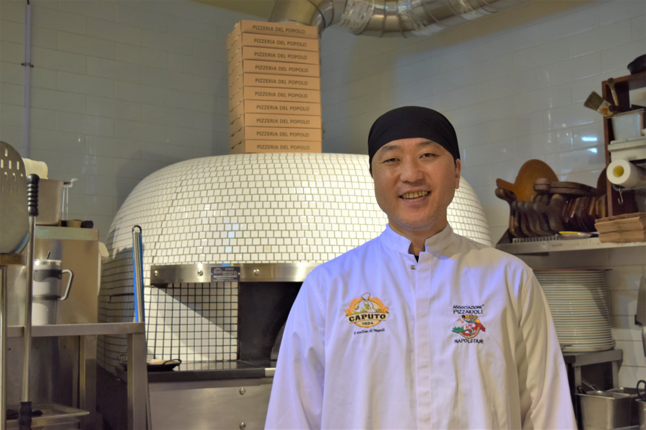 Owner-Chef Yu Jun-hwan poses at his pizzeria, Pizzeria del Popolo, in Goyang, Gyeonggi Province, during an interview with The Korea Herald, Tuesday. (Kim Hae-yeon/ The Korea Herald)