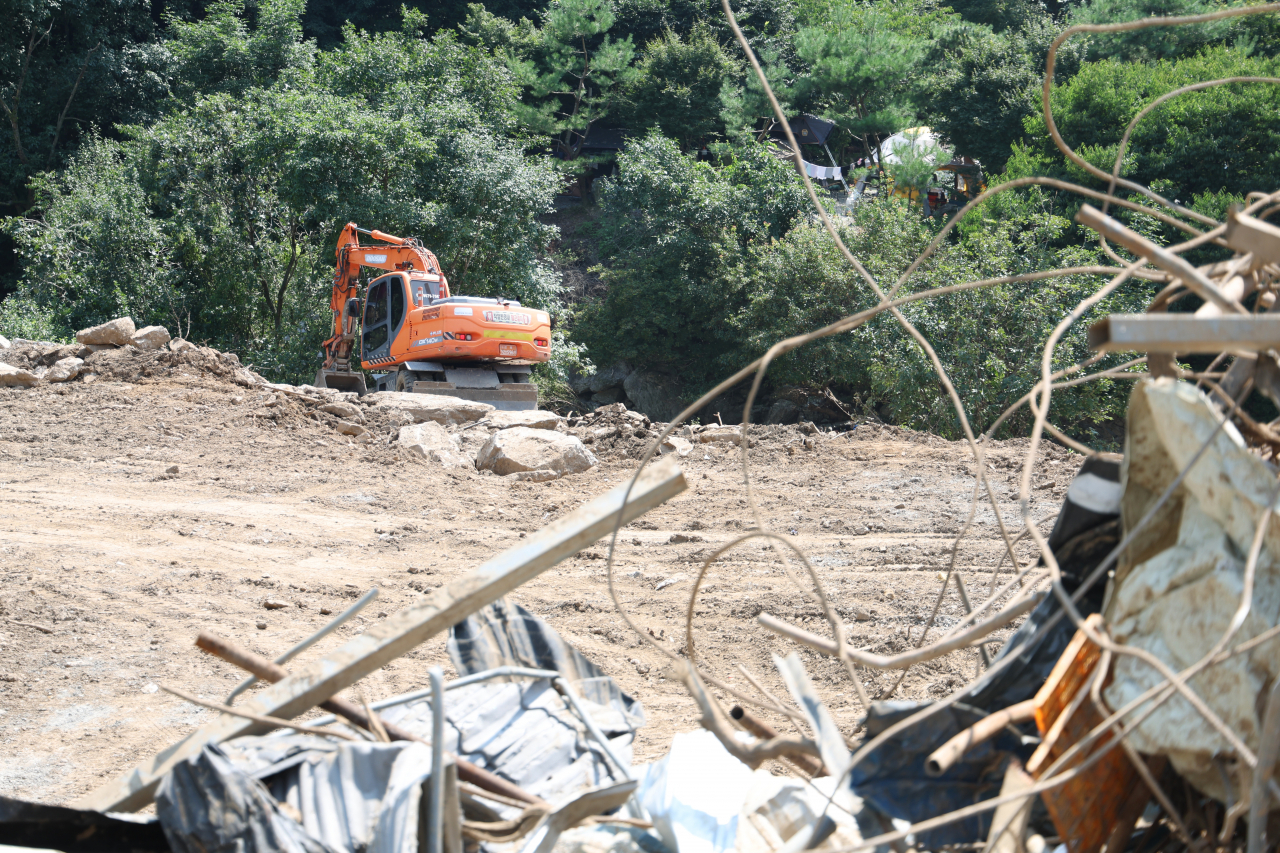 Restoration works continue Sunday at Samga-ri, Punggi-eup in Youngju, North Gyeongsang Province, where people have been killed and homes have been destroyed due to recent heavy downpours and landslides. (Yonhap)