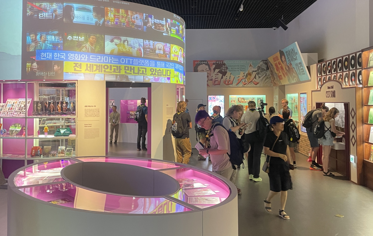 Visitors view an exhibition titled “The Pop Culture We Loved and Rise of the Korean Wave