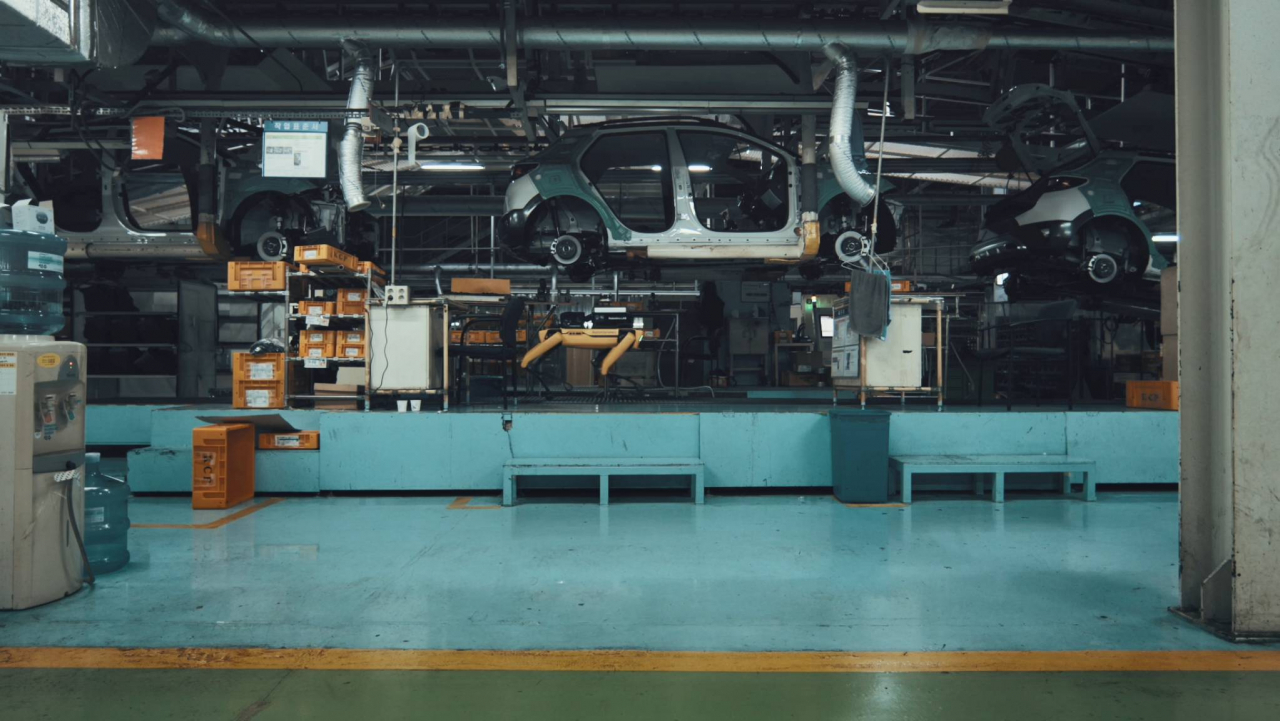 An image of Boston Dynamics' four-legged robot Spot working at an automotive plant (Boston Dynamics)