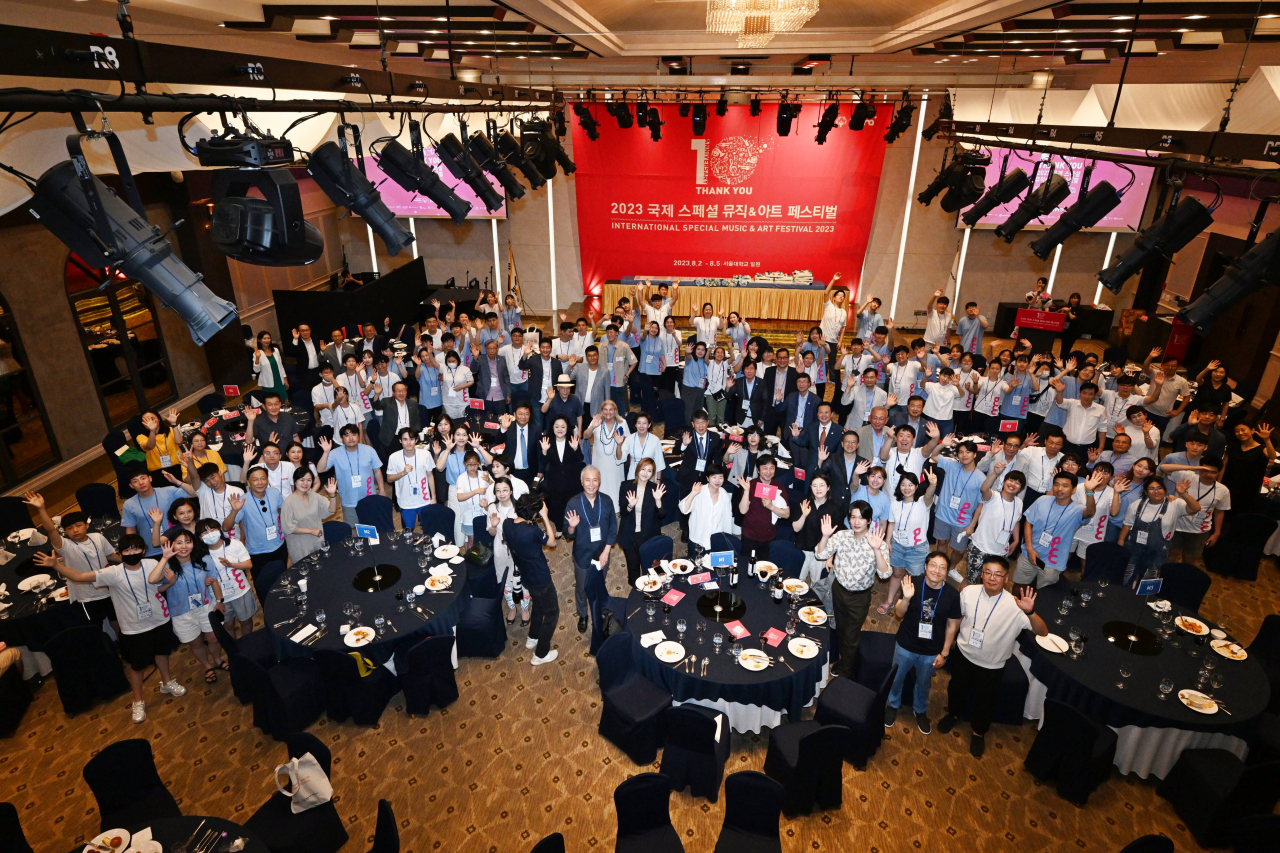 Participants of the 2023 International Special Music & Art Festival pose for photos during the welcome banquet on Aug. 1 at Seoul National University. (Special Olympics Korea)