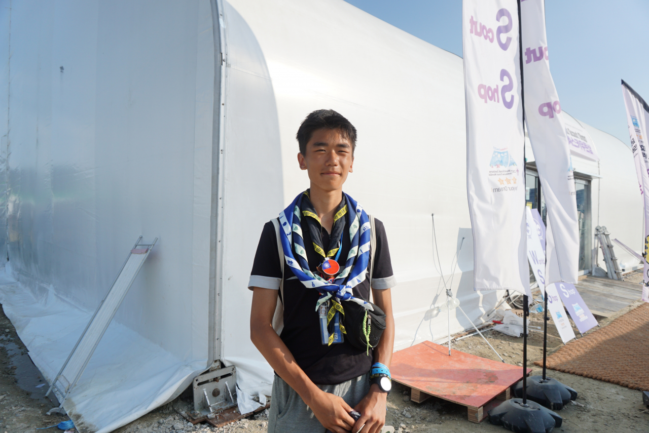 A Swedish Scout, David Yao, poses for a picture in front of the souvenir shop in the Jamboree Delta, Sunday. (Ministry of Gender Equality and Family)