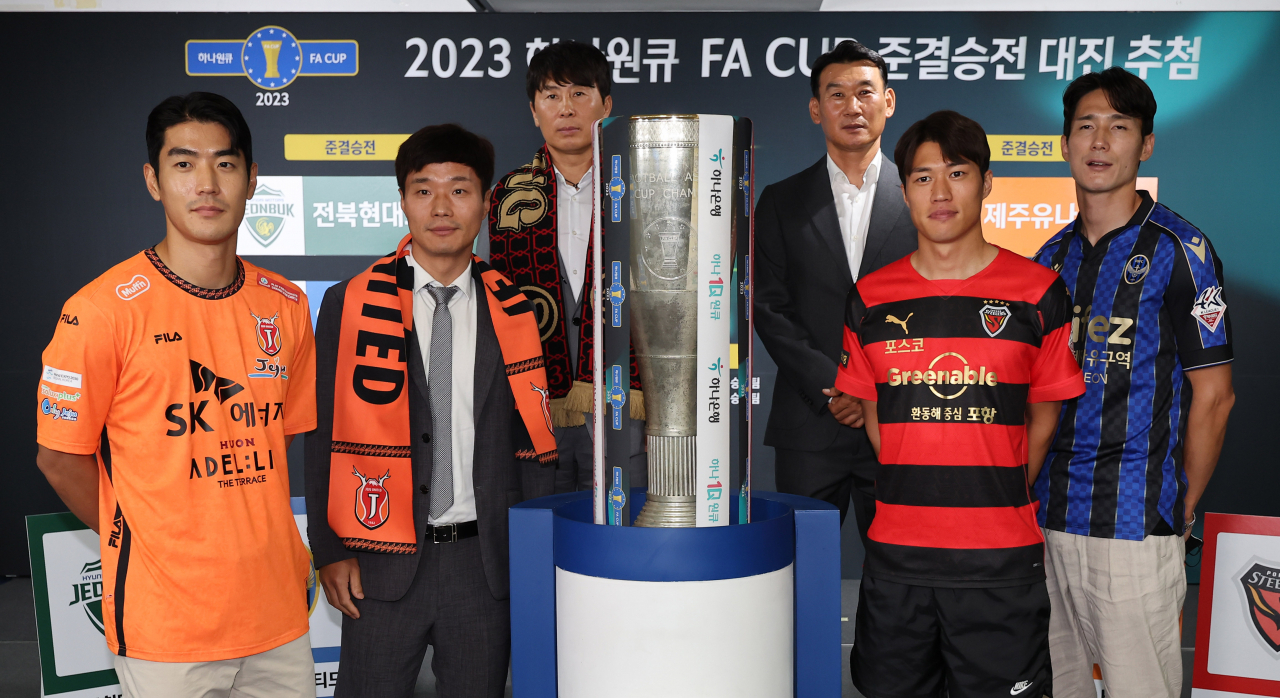 In this file photo from July 18, 2023, participants of the draw for the FA Cup semifinals pose next to the trophy after the draw ceremony at the Korea Football Association House in Seoul. From left: Jeju United defender Lee Ju-yong, Jeju United head coach Nam Ki-il, Pohang Steelers head coach Kim Gi-dong, Incheon United head coach Cho Sung-hwan, Pohang Steelers forward Kim Seung-dae and Incheon United defender Oh Ban-suk. (Yonhap)