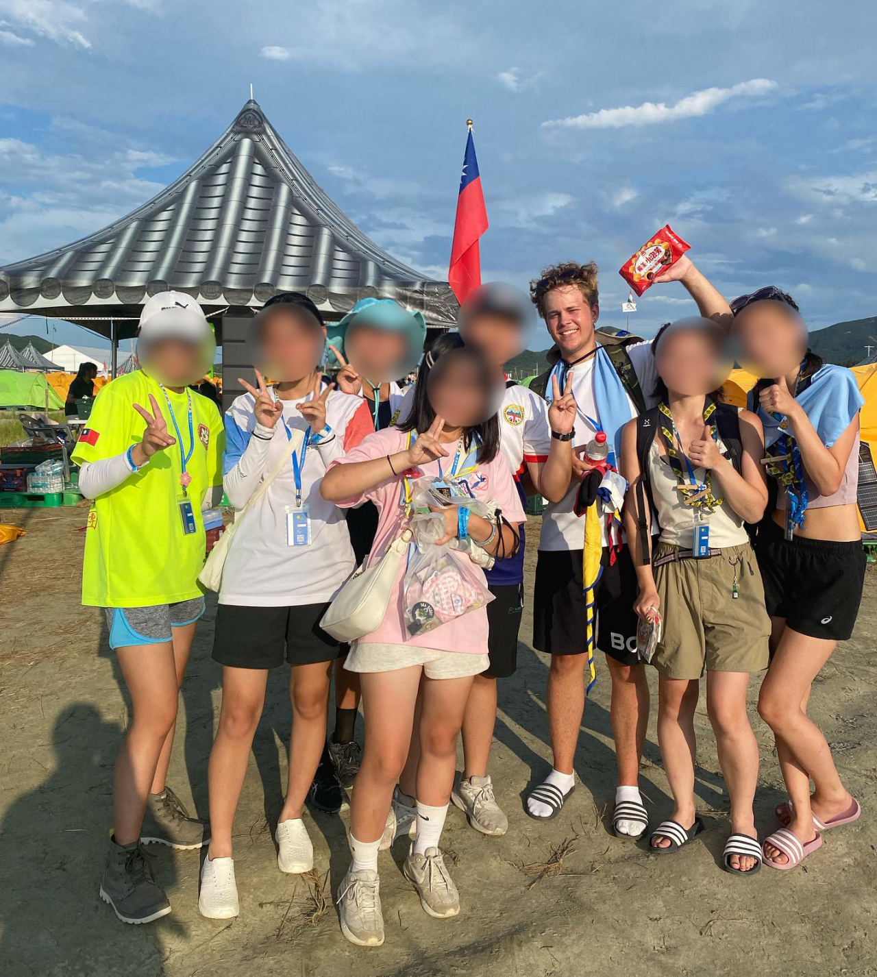 Herman Lind, a Swedish Scout, smiles for a photo with Taiwanese Scouts at the Saemangeum Jamboree campsite. (Courtesy of Herman Lind)