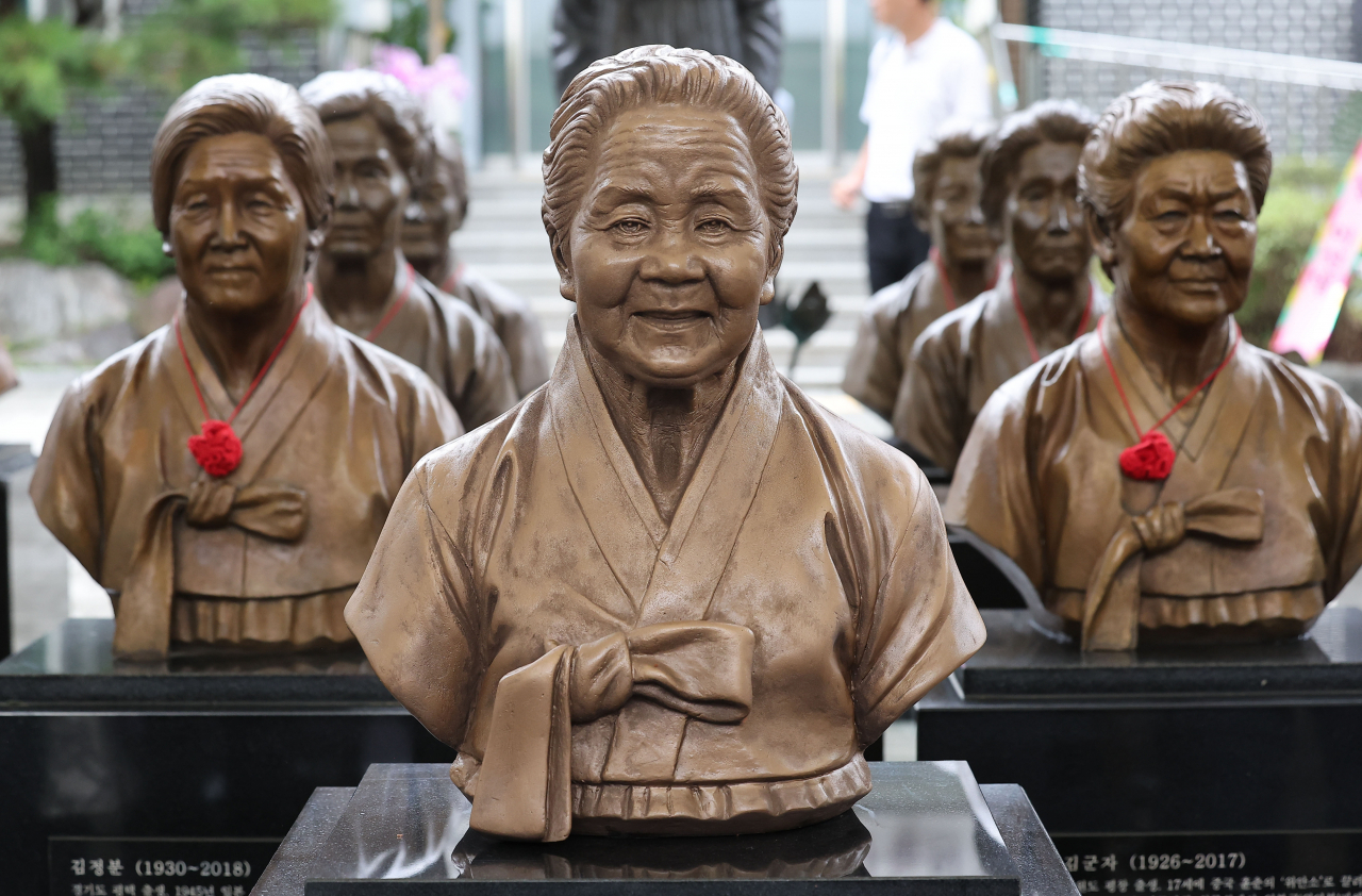 A new sculpture of Lee Ok-seon (center), a 