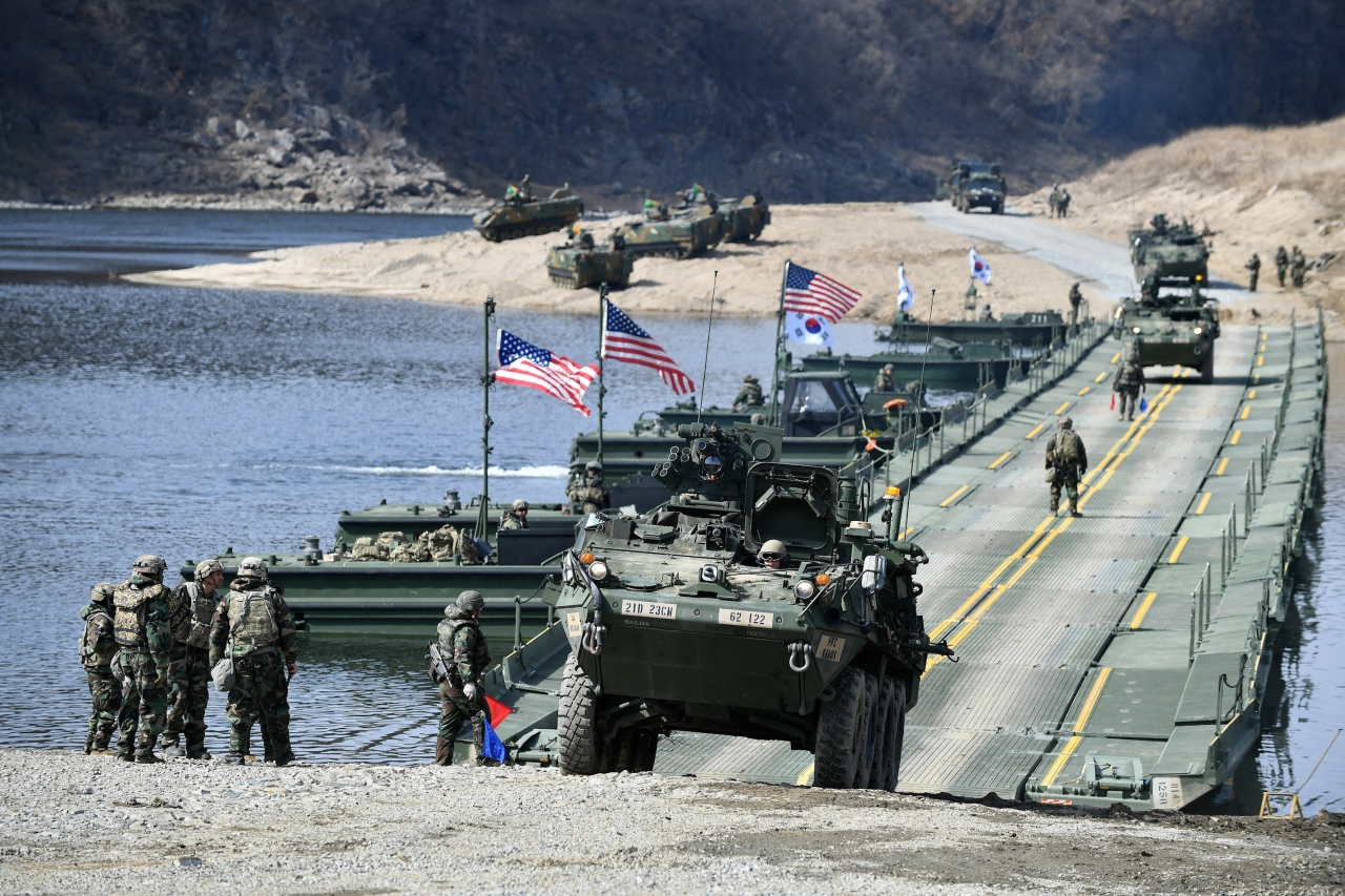 A Stryker vehicle, driven by Soldiers assigned to the US 2nd Infantry Division/South Korea-US Combined Division, crosses a temporary floating bridge during 