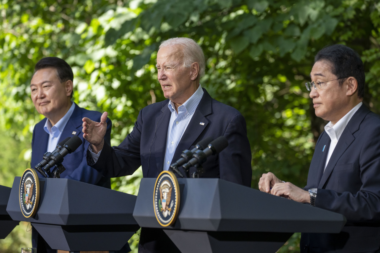 US President Joe Biden (center) speaks with Japanese Prime Minister Fumio Kishida (right) and South Korean President Yoon Suk Yeol during a joint news conference Friday at Camp David, Maryland. (Photo - AP)