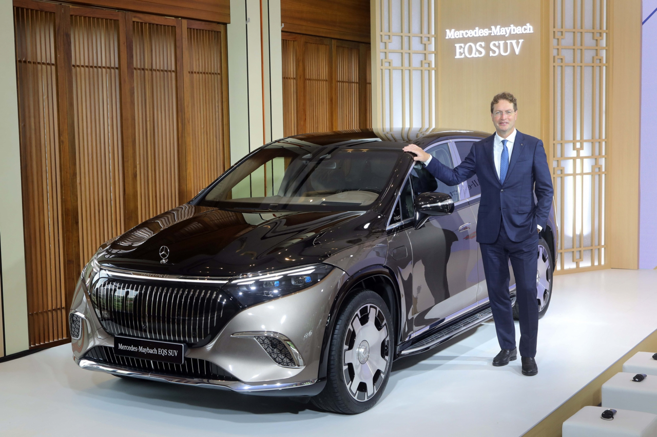 Mercedes-Benz Group CEO Ola Kallenius poses with the Maybach EQS sports utility vehicle before a press conference at Hotel Shilla in central Seoul on Thursday. (Mercedes-Benz Korea)