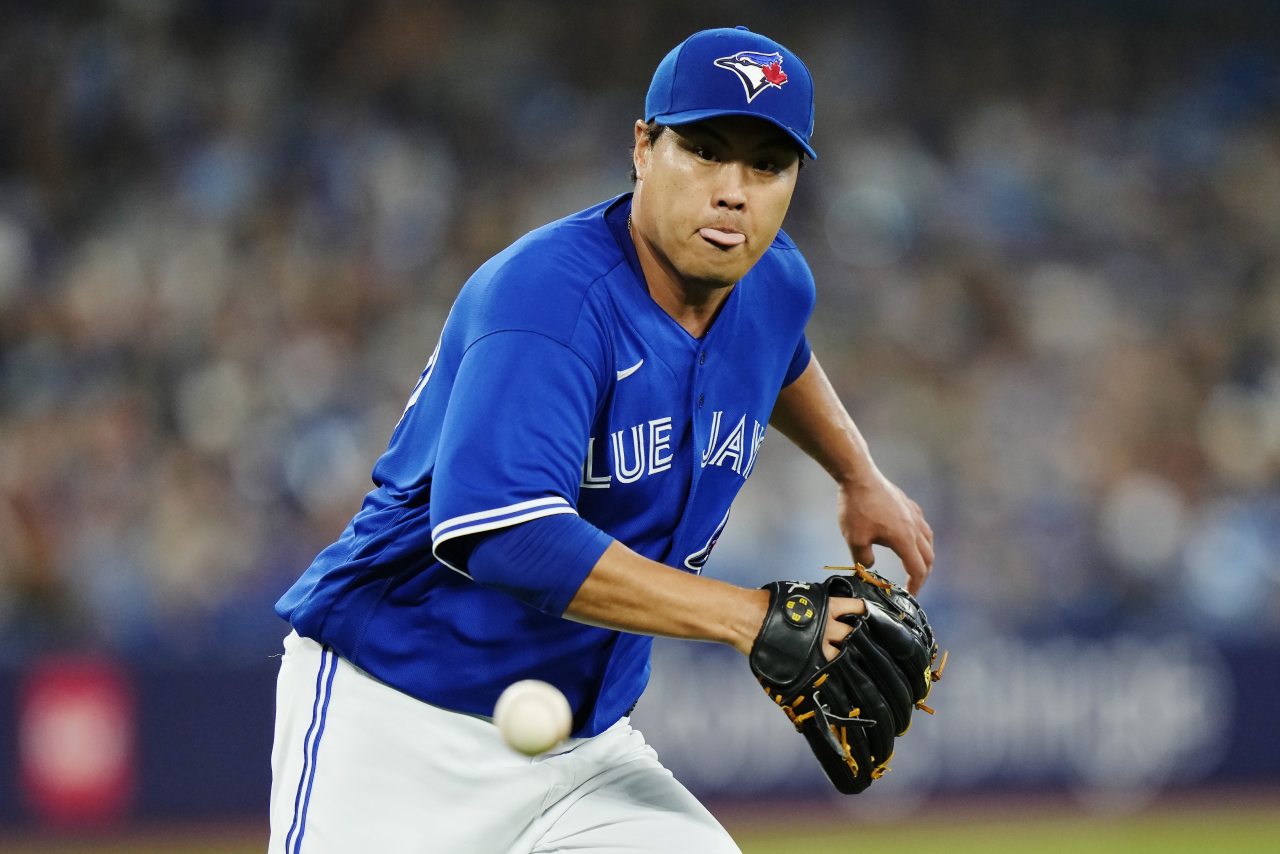 Toronto Blue Jays starter Ryu Hyun-jin fields a ball hit by Tyler Freeman of the Cleveland Guardians during the top of the second inning of a Major League Baseball regular season game at Rogers Centre in Toronto on Saturday. (Associated Press,-Yonhap)
