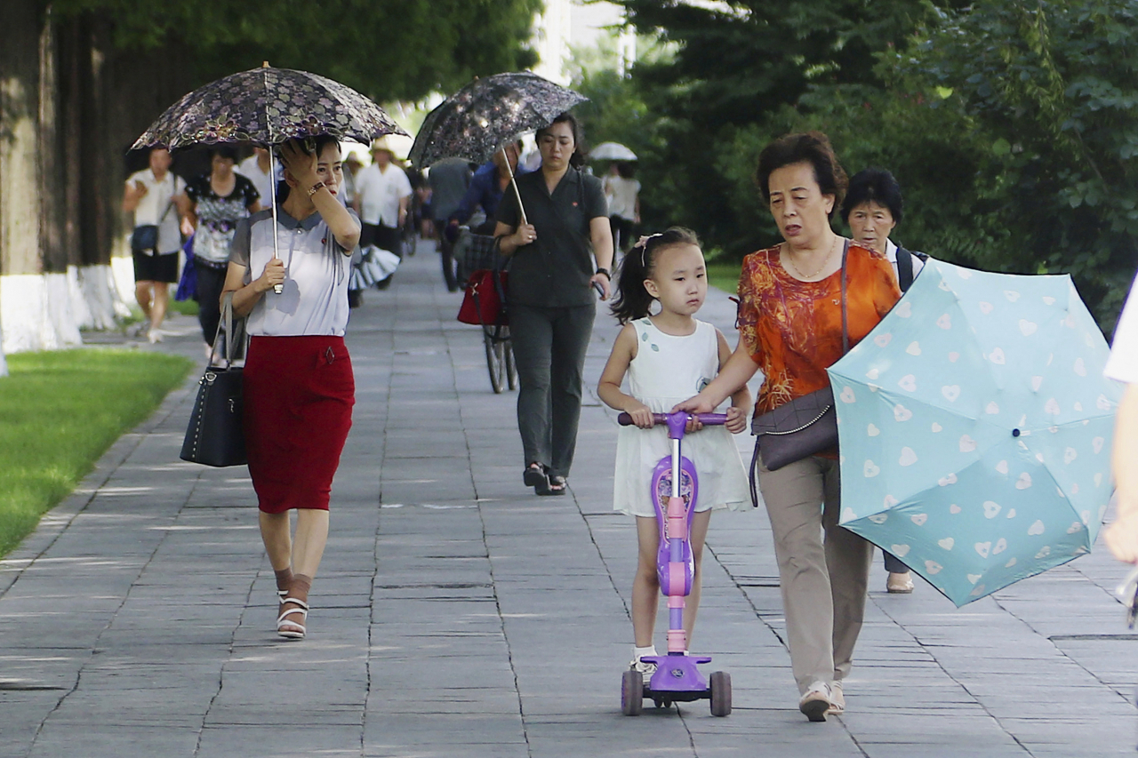 People walk in the Ryomyong street in Pyongyang, North Korea, Tuesday, Aug. 8. (AP-Yonhap)