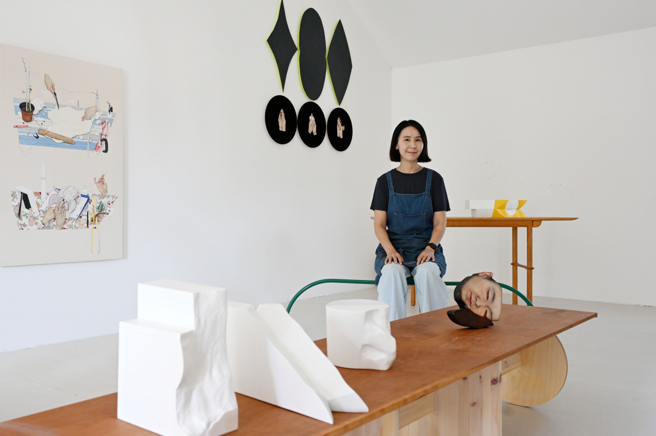 Lee Jin-ju poses for a photo at her studio in Paju, Gyeonggi Province, Friday. (Lee Sang-sub/The Korea Herald)
