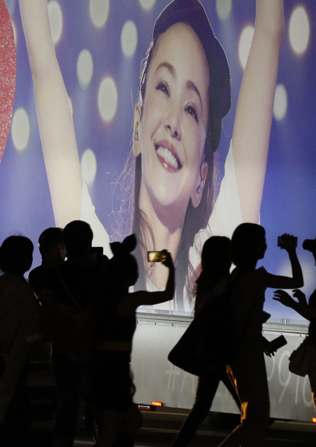 Fans of Namie Amuro gather around her poster for her concert at the Okinawa Convention Center in Okinawa prefecture, Japan on Sept. 15, 2018. (Yonhap)