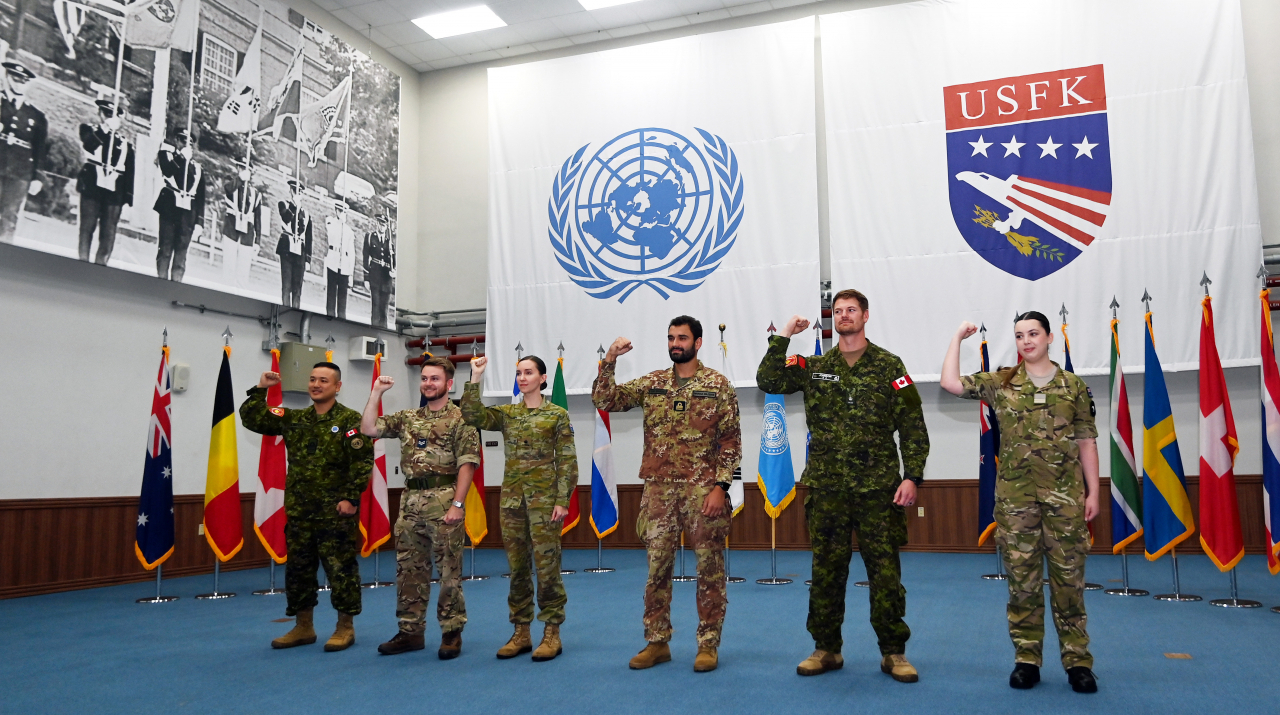Five augmentees and one staff member from the five member states of the United Nations Command pose for a group photo during an interview on Aug. 30 at the headquarters of the UNC located within Camp Humphreys, the US base in the city of Pyeongtaek, Gyeonggi Province. (Korea Herald/ Pool Photo)