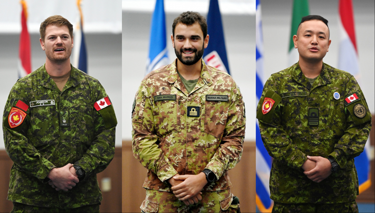 Canadian Army Maj. Simon Johnson (left), Lt. Nicolo Imbriani, from the Infantry Brigade of the Italian Navy Marina Militare (center) and Royal Canadian Navy Lt. Cdr. Kang Hyung-wook speak during an interview on Aug. 30 at the headquarters of the UN Command located within Camp Humphreys, the US base in Pyeongtaek, Gyeonggi Province. (Korea Herald/ Pool Photo)