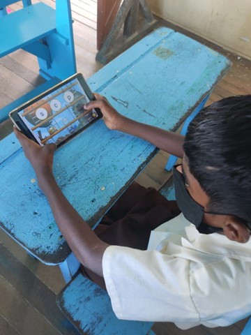 A learner uses GraphoGame. (UNESCO website)