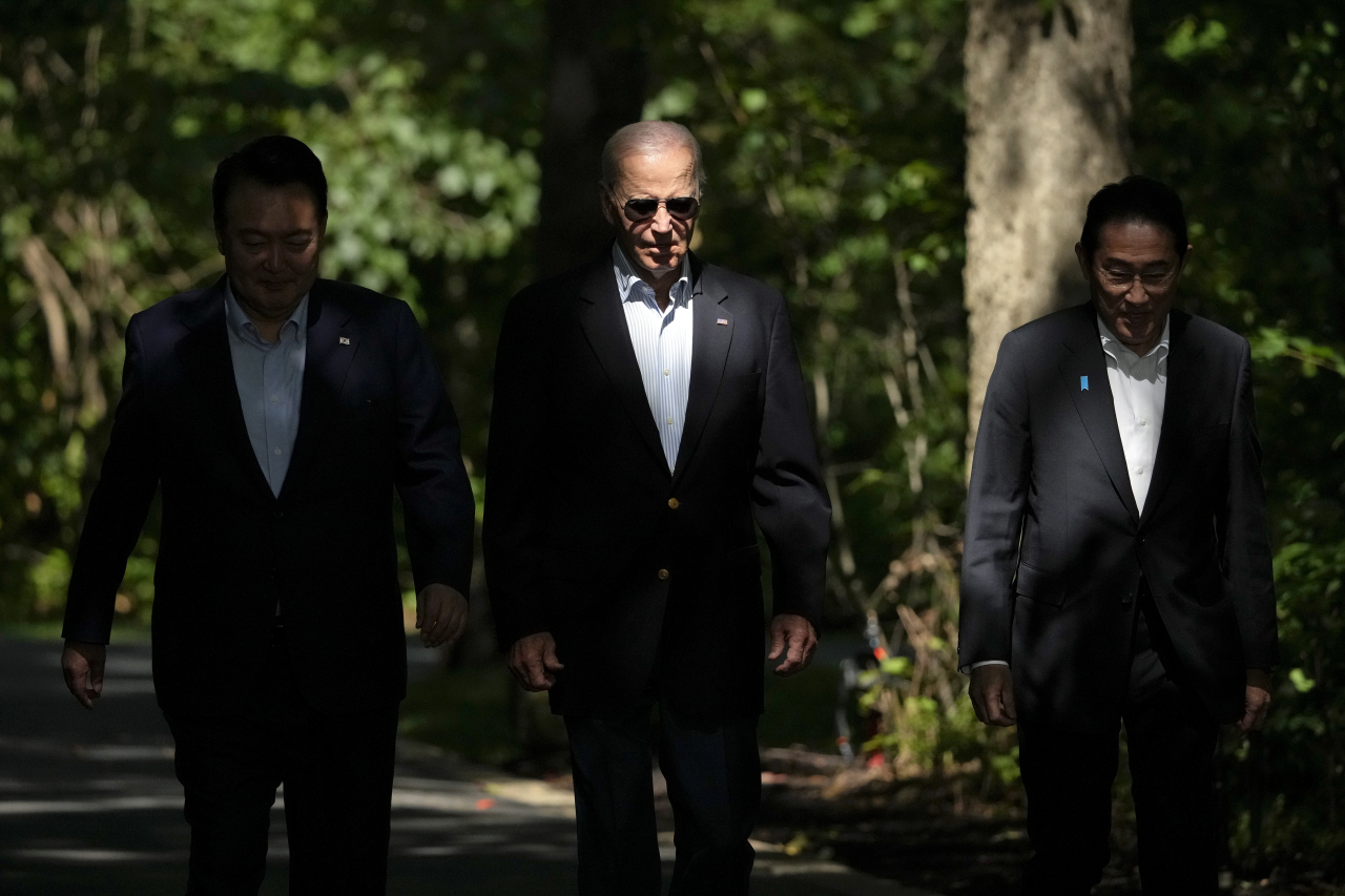 From left, South Korea's President Yoon Suk Yeol, President Joe Biden and Japan's Prime Minister Fumio Kishida arrive for a joint news conference, Friday, Aug. 18, 2023, at Camp David, the presidential retreat, near Thurmont, Md. (Photo - AP)