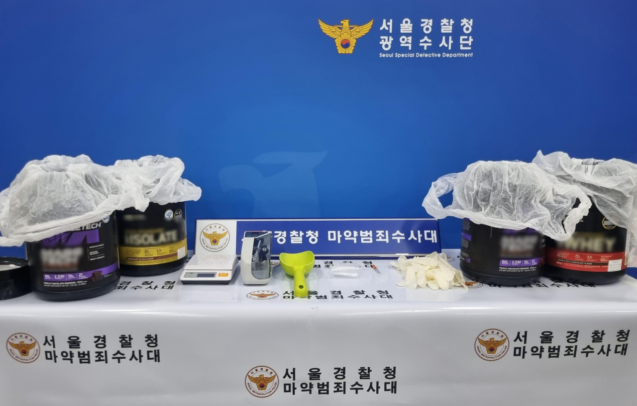 This photo shows a seized batch of methamphetamine concealed inside protein powder containers. (Seoul Metropolitan Police Agency)