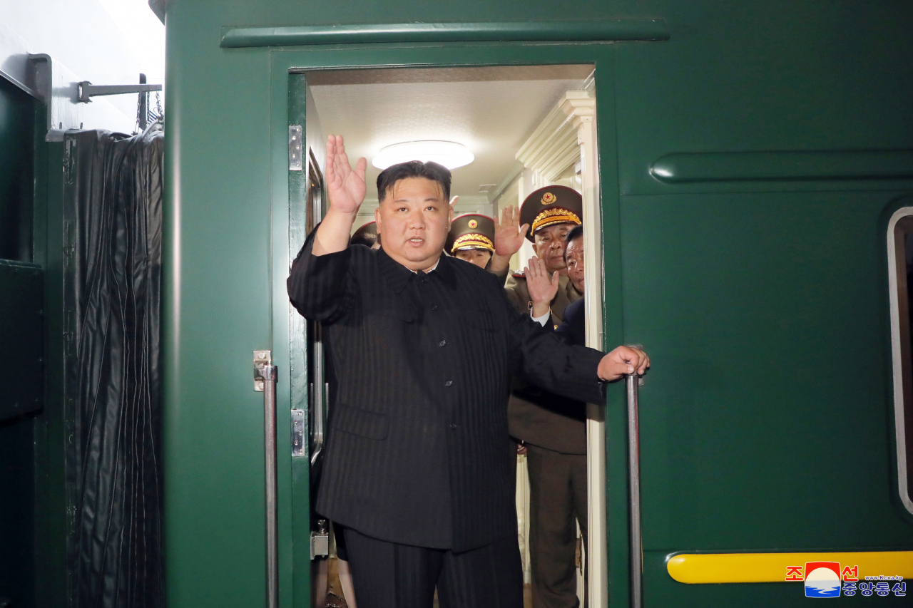 North Korean leader Kim Jong-un gets aboard his family train as he departs for Russia on Sunday, according to the North’s state media on Tuesday. (Yonhap-Korean Central News Agency)