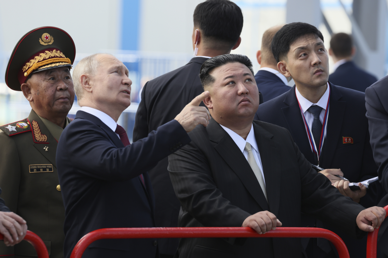Russian President Vladimir Putin (left) and North Korea's leader Kim Jong Un examine a launch pad during their meeting at the Vostochny cosmodrome outside the city of Tsiolkovsky, about 200 kilometers (125 miles) from the city of Blagoveshchensk in the far eastern Amur region, Russia, on Wednesday. (AP)